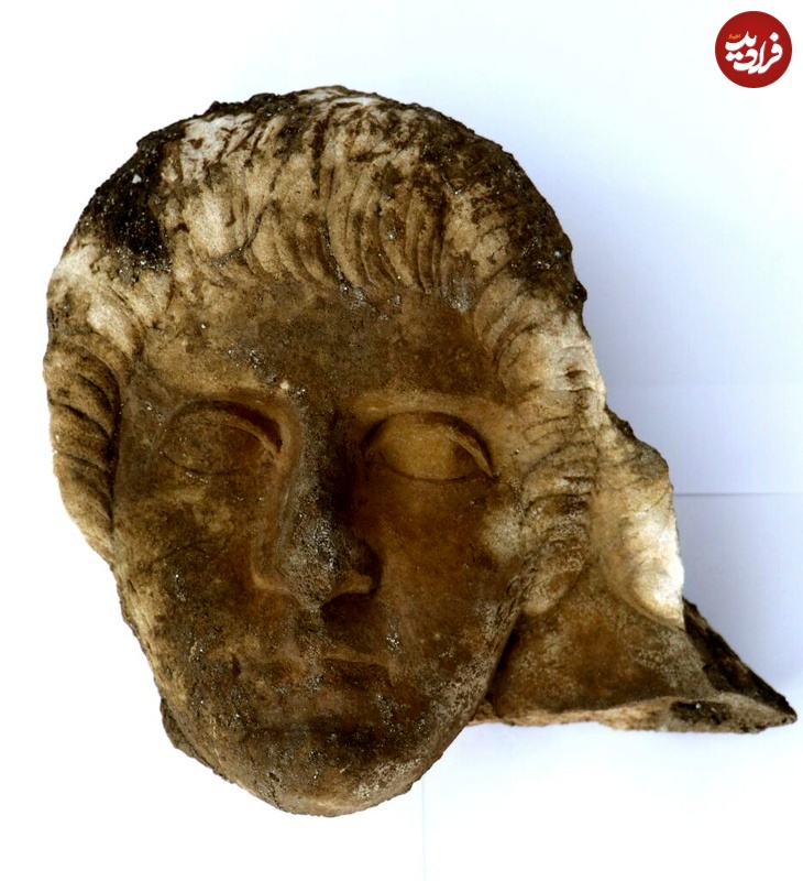 carved-marble-face-of-a-woman-935x1024
