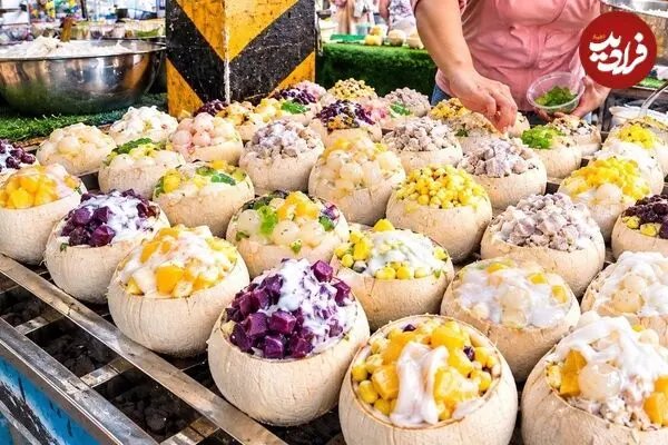 ببینید| غذای خیابانی در تایلند؛ تهیه یک غذای محبوب با نارگیل، برنج و دوریان در بانکوک