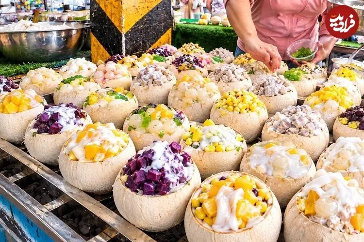 ببینید| غذای خیابانی در تایلند؛ تهیه یک غذای محبوب با نارگیل، برنج و دوریان در بانکوک