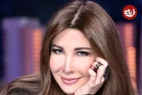 عکس| سفر در زمان؛ «نانسی عجرم» در کنار تصویر نخست وزیر مقتول لبنان در بیروت؛ سال 1384