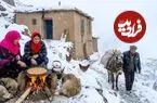 ببینید| غذای روستایی در افغانستان؛ پخت پیتزا روی آتش در هوای برفی روستا