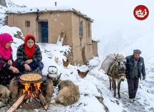 ببینید| غذای روستایی در افغانستان؛ پخت پیتزا روی آتش در هوای برفی روستا