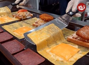 ببینید| غذای خیابانی در کره؛ آماده سازی ساندویچ نان تست با همبرگر، تخم مرغ و پنیر در سئول