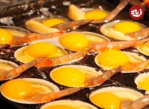 ببینید| غذای خیابانی در چین؛ پخت یک غذای خاص با تخم بلدرچین و میگو در شنژن