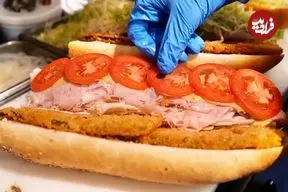 ویدئو| غذای خیابانی در آمریکا؛ تهیه ساندویچ هوگی در فیلادلفیا