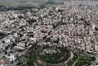 عکس| سفر به ایران قدیم؛ منظرۀ یک میدان در شهر «کرمانشاه» در دوران قاجار