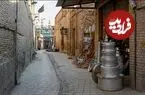 عکس| سفر زمان؛ عبور یک زن از یکی از کوچه‌های دزفول؛ 91 سال قبل