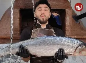 ببینید| غذای خیابانی در ایران؛ کباب ماهی بزرگ شکم پر با سبزی پلو