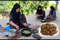 ببینید؛ غذای روستایی در ایلام؛ پخت دلمه برگ مو سنتی توسط مادربزرگ روستایی