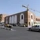 عکس| سفر به ایران قدیم؛ زنان و مردان تهرانی در کنار دروازه میدان توپخانه در دوران قاجار
