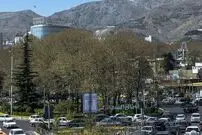 عکس| سفر به تهران قدیم؛ نمایی از سرپل تجریش در یک روز برفی؛ سال 1363
