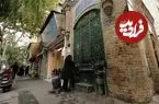 عکس| سفر به ایران قدیم؛ تصویری از یک سقاخانه در یکی از خیابان‌های تهران؛ 99 سال قبل