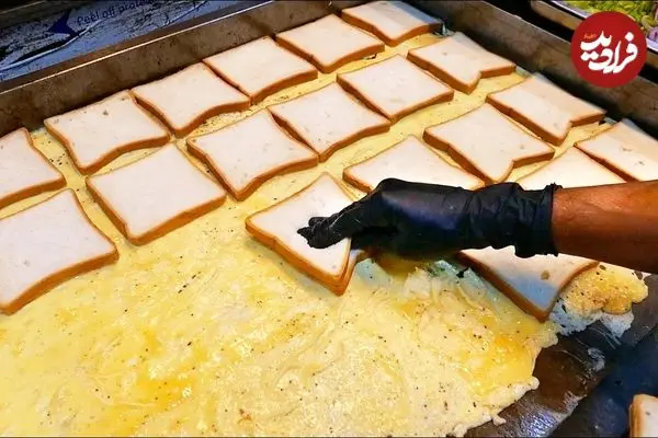 ببینید| غذای خیابانی در سریلانکا؛ تهیه ساندویچ املت با پنیر در کلمبو