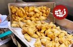 ببینید| غذای خیابانی در آمریکا؛ بال مرغ سوخاری و تند در شیکاگو