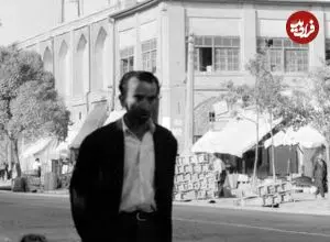 عکس| سفر به تهران قدیم؛ عبور یک مرد و گوسفندانش از «خیابان سیروس»؛ 65 سال قبل
