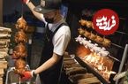 ببینید| غذای خیابانی در کره؛ کباب مرغ شکم پر روی هیزم بلوط در سئول