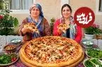 ببینید| غذای روستایی در ایران؛ پخت پیتزا با مرغ و سوسیس