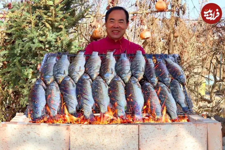ببینید| غذای روستایی در چین؛ کباب کردن 20 ماهی  به روش سنتی در روستا