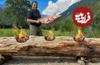 ببینید| غذای روستایی در آذربایجان؛ پخت مرغ، ماهی و گوشت روی تنه درخت