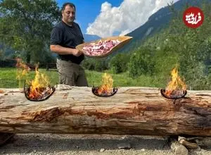 ببینید| غذای روستایی در آذربایجان؛ پخت مرغ، ماهی و گوشت روی تنه درخت