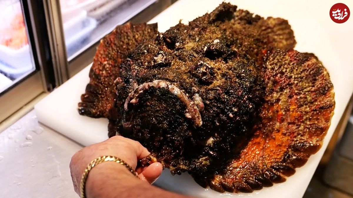 ببینید؛ غذای خیابانی در ژاپن؛ پخت غذا با سنگ ماهی غول پیکر در اوکیناوا