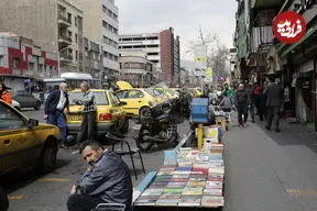 عکس| سفر به تهران قدیم؛ خودروهای کلاسیک در حال عبور از خیابان انقلاب؛ دهه 30
