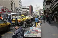 عکس| سفر به تهران قدیم؛ خودروهای کلاسیک در حال عبور از خیابان انقلاب؛ دهه 30