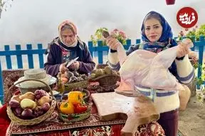 ببینید| غذای روستایی در ایران؛ پخت بوقلمون شکم پر در تنور در روستایی کوهستانی
