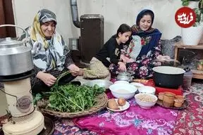 ببینید| غذای روستایی در ایران؛ پخت پلو مخلوط به روش سنتی و در هوای برفی