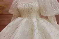 لباس عروسی که یک و نیم برابر عروس وزن دارد