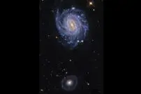 عکس روز ناسا از دو کهکشان و یک ابرنواختر