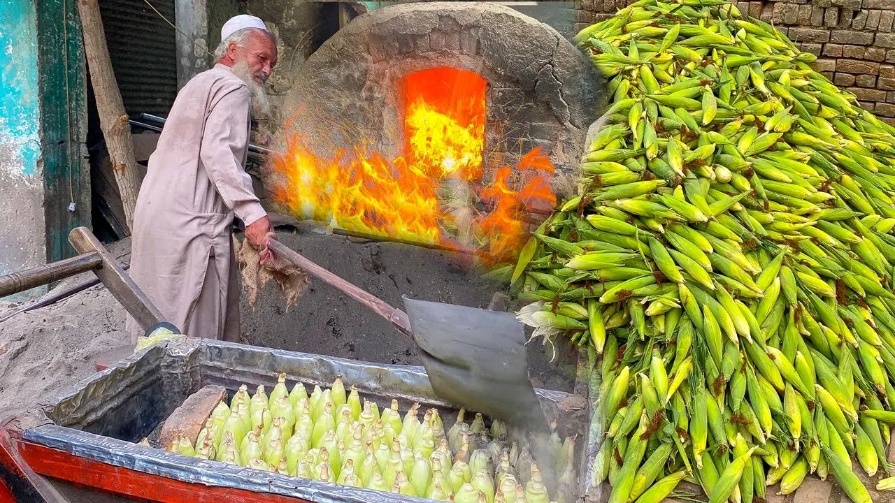 (ویدئو) ببینید این پیرمرد پاکستانی چگونه ذرت های تازه را در شن می پزد