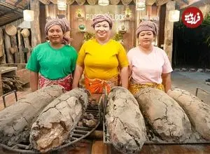 ببینید| غذای روستایی در سنگاپور؛ پخت ماهی در گِل روی آتش 