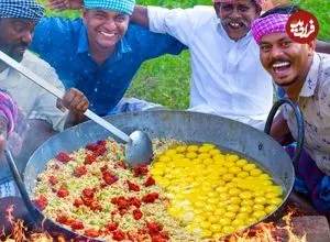 ببینید| غذای روستایی در هند؛ پخت یک غذای سنتی با برنج سرخ شده، مرغ و تخم مرغ