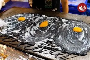 ببینید| غذای خیابانی در تایلند؛ تهیه پنکیک تخم مرغ و پنیر در بانکوک