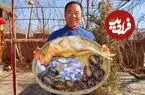 ببینید| غذای روستایی در چین؛ پخت خوراک سنتی با خروس، صدف و اختاپوس