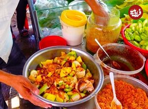 ببینید؛ غذای خیابانی در کامبوج؛ برش آناناس، انبه، گواوا و تهیه سالاد میوه ترش در پنوم پن