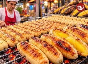 ببینید| غذای خیابانی در تایلند؛ مراحل دیدنی کباب کردن موز روی آتش در بانکوک