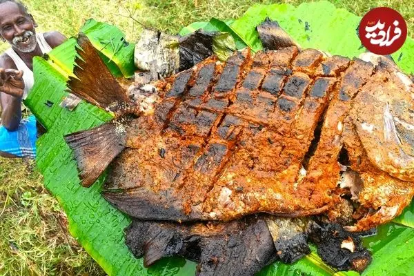 ببینید| غذای روستایی در هند؛ کباب کردن ماهی پامفرت سیاه در برگ موز