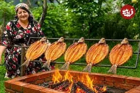 ببینید| غذای روستایی در آذربایجان؛ کباب کردن ماهی قزل آلا روی آتش