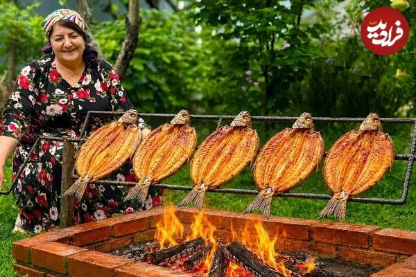 ببینید| غذای روستایی در آذربایجان؛ کباب کردن ماهی قزل آلا روی آتش