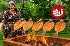ببینید| غذای روستایی در آذربایجان؛ کباب کردن ماهی قزل آلا روی آتش
