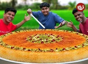 ببینید| غذای روستایی در هند؛ مراحل دیدنی پخت کنافه غول پیکر در طبیعت