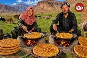 ببینید| غذای روستایی در افغانستان؛ پخت نان روغنی روی آتش توسط زوج مسن افغان