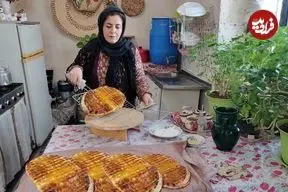 ببینید| غذای روستایی در ایران؛ پخت نان محلی به روش سنتی در هوای برفی روستا