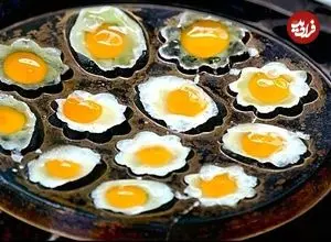 ببینید| غذای خیابانی در تایلند؛ تهیه کیک پاندان و تخم بلدرچین سرخ شده در بانکوک