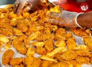 ببینید| غذای خیابانی در آمریکا؛ پخت بال مرغ با تمر هندی در نیویورک