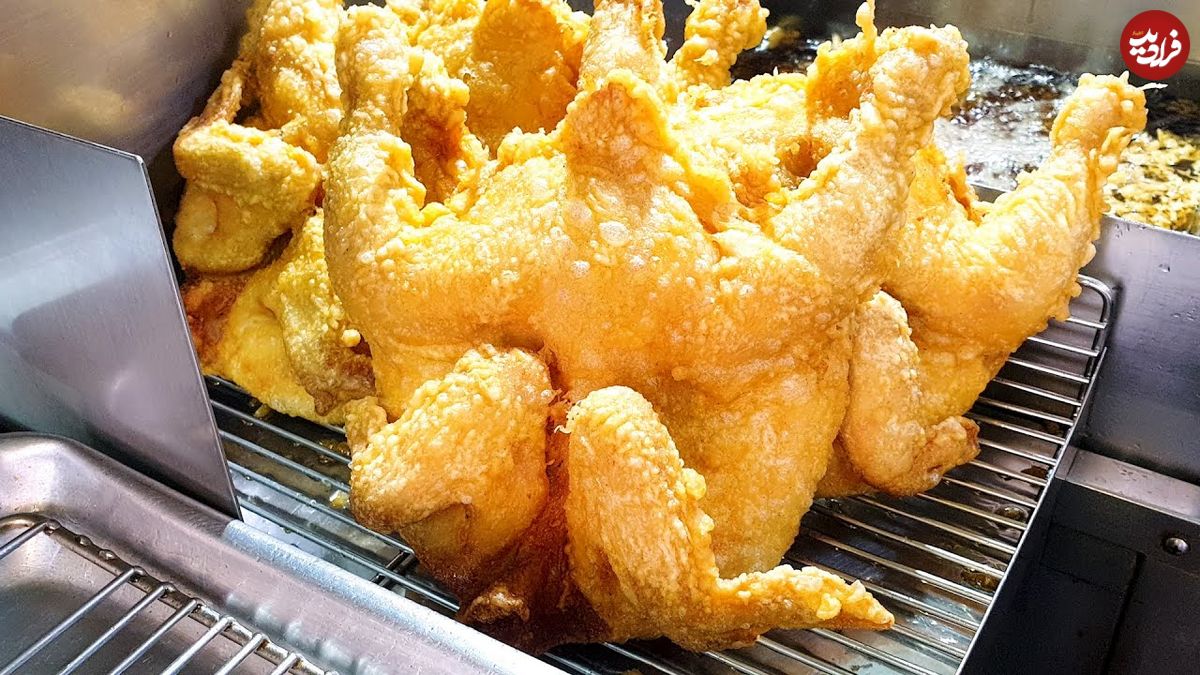 ببینید؛ غذای خیابانی در کره؛ تهیه مرغ کامل سوخاری با هیزم بلوط در سئول