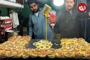 ببینید| غذای خیابانی در پاکستان؛ پخت دوبل برگر با تخم مرغ در کراچی 