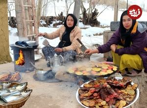 ببینید؛ غذای روستایی در افغانستان؛ پخت ماهی با سیب زمینی و گوجه در هوای برفی 